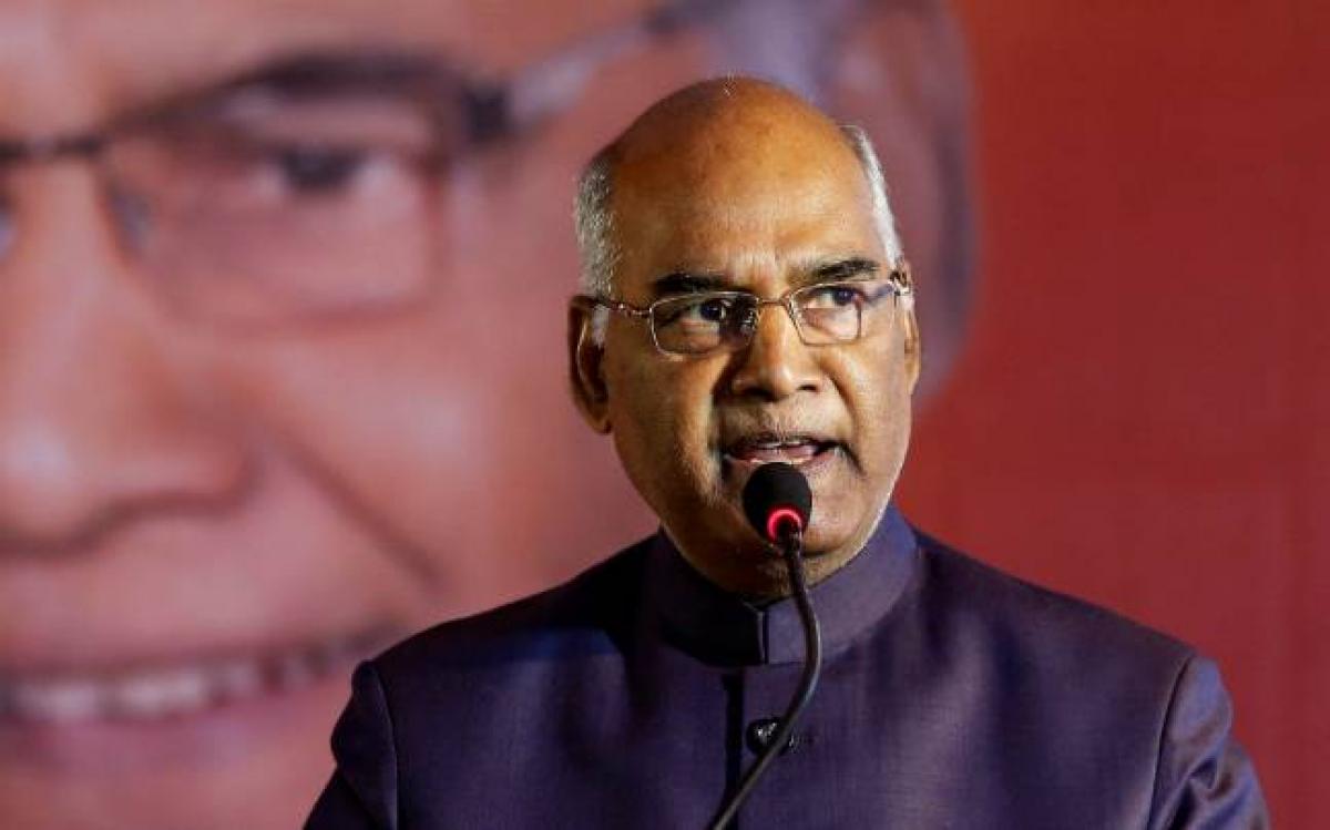 Kovind arrives in Kerala, takes salute amid pouring rain